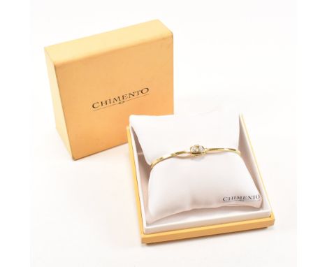 A Chimento 18ct bi colour gold and diamond bangle bracelet. The hinged two piece bangle having a straight yellow gold band wi