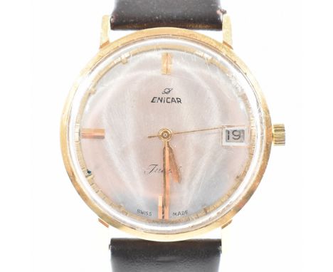 A vintage 18ct yellow gold Enicar Jubil&eacute; Swiss made wristwatch. The watch having a circular silvered dial with gold to