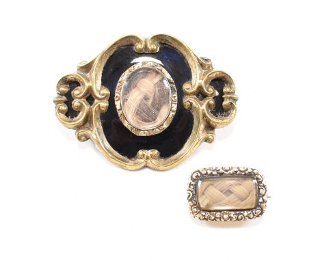 Two 19th century hair work mourning brooch pins. The first antique pin having a central oval locket panel with braided blonde