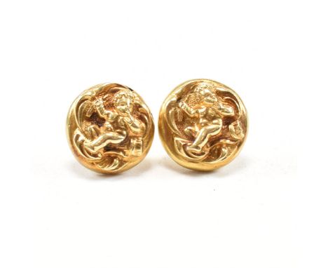 A pair of Victorian 15ct yellow gold stud earrings. The earrings of rounded button form having repousse depictions of cherub 