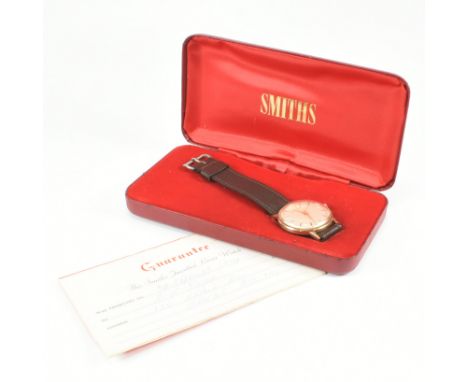 A Smiths Astral 9ct gold British Railways wrist watch. The watch having a champagne dial with dagger hands. The case baring t
