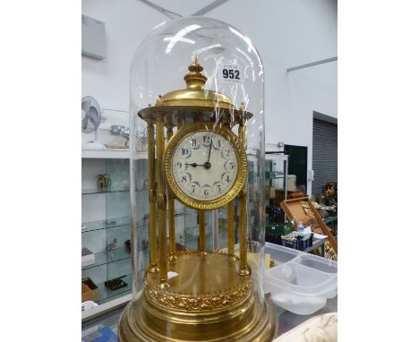 A GILT BRASS ANNIVERSARY CLOCK UNDER GLASS DOME. 