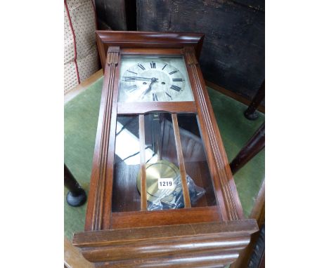 A WALNUT CASED WALL CLOCK 