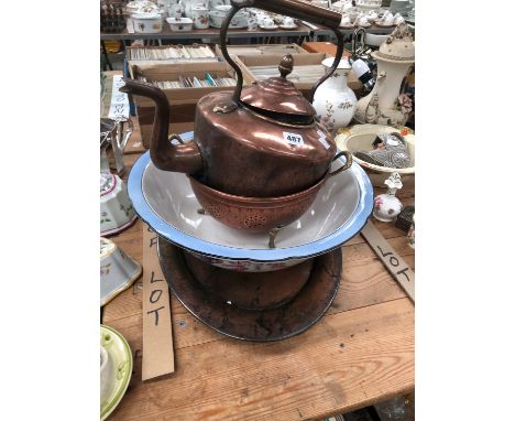A COPPER KETTLE, COLLANDER AND OVAL DISH TOGETHER WITH A BOWL FROM A WASHING SET.