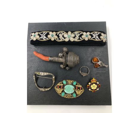 AN ANTIQUE HALLMARKED SILVER AND CORAL PART BABIES RATTLE TOGETHER WITH A PASTE BUCKLE BROOCH, A VINTAGE EASTERN STYLE BROOCH