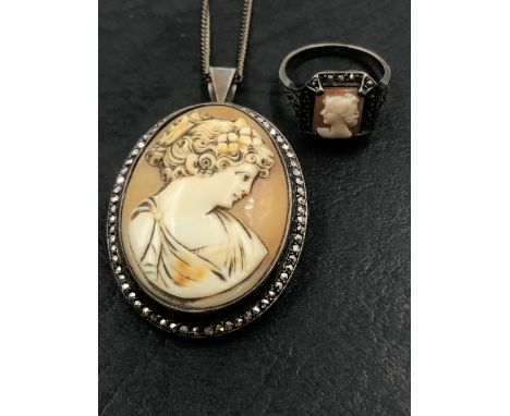 A VINTAGE PORTRAIT CAMEO BROOCH / PENDANT WITH A MARCASITE SET FRAME, STAMPED STERLING ASSESSED AS SILVER, SUSPENDED FROM A S