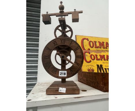 A WOODEN MODEL CLOCK