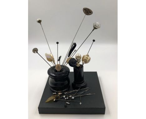 A LARGE ENAMEL AND PASTE HAT PIN TOGETHER WITH A COLLECTION OF OTHER VINTAGE HAT PINS AND TWO EBONY JARS. 