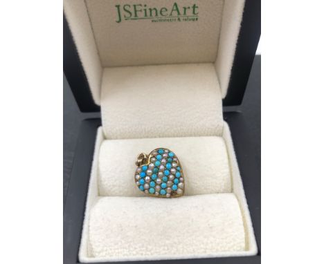 AN ANTIQUE TURQUOISE AND PEARL PUFFED HEART PENDANT, NO ASSAY MARKS, ASSESSED AS 9ct GOLD. MEASUREMENTS 1.8 X 1.5cms. WEIGHT 