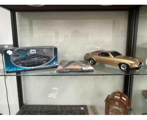 A BRADFORD EXCHANGE MUSTANG CAR AN ASTON MARTIN BY SOLIDO TOGETHER WITH A NINE CAR TEA SHIRT
