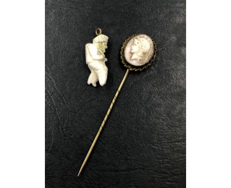 A EARLY 20th CENTURY CARVED PORTRAIT CAMEO OF A TROJAN BUST MOUNTED AS A STICK PIN AND AN ANTIQUE CORAL SHELL GOBBO HUNCHBACK