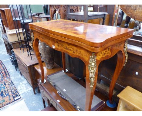 A FRENCH STYLE WALNUT INLAID AND BRASS MOUNTED FOLD OVER CARD TABLE. H 82 W 92 D 46