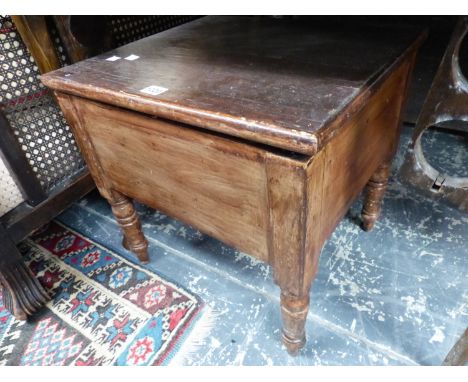 AN ANTIQUE COMMODE 