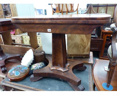 A VICTORIAN FLAME MAHOGANY FOLD OVER CARD TABLE.