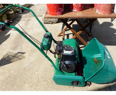 A LARGE QUALCAST CYLINDER MOWER WITH PETROL ENGINE.