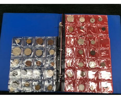 A BINDER OF VARIOUS VINTAGE WORLD COINS. 