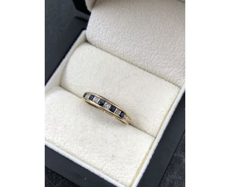 A 9ct HALLMARKED GOLD SAPPHIRE AND DIAMOND HALF ETERNITY RING. FINGER SIZE O. WEIGHT 1.40grms. 