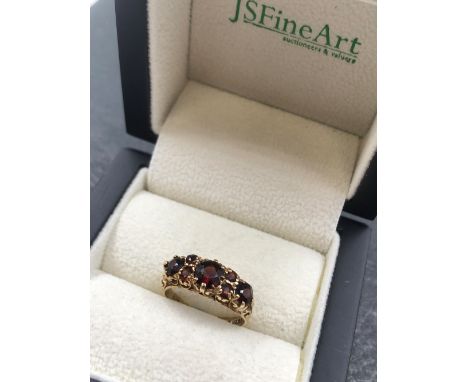 A VINTAGE 9ct HALLMARKED GOLD GARNET CARVED HALF HOOP RING. FINGER SIZE K. WEIGHT 2.95grms. 