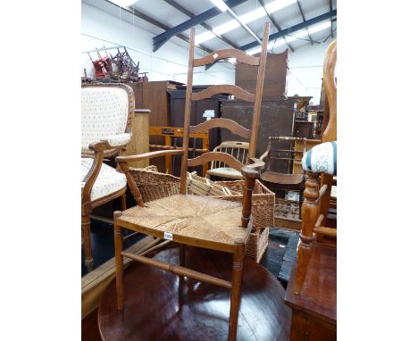 AN ARTS AND CRAFTS LADDER BACK ARMCHAIR.