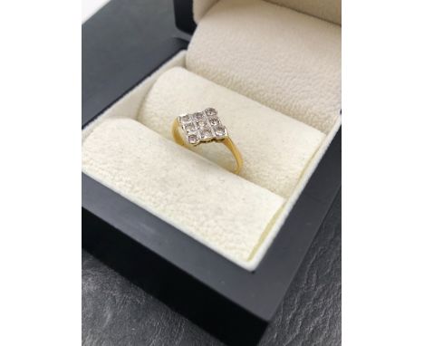 AN 18ct GOLD STAMPED DIAMOND SHAPE GEMSET CLUSTER RING. FINGER SIZE K 1/2. NO ASSAY MARKS. WEIGHT 1.87grms.