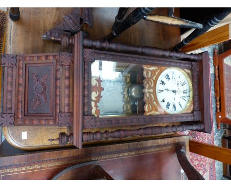 AN ANTIQUE WALL CLOCK. 