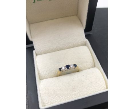 A 9ct HALLMARKED GOLD SAPPHIRE AND DIAMOND FIVE STONE HALF ETERNITY STYLE RING. FINGER SIZE K. WEIGHT 1.49grms. 