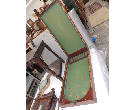 A VICTORIAN MAHOGNAY BAGATELLE TABLE.