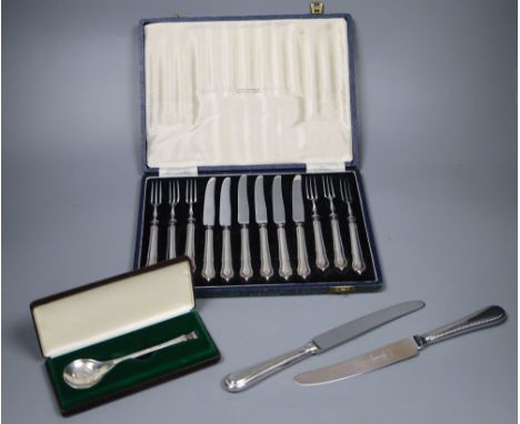 A cased set of 6 pairs of silver handled dessert knives &amp; forks, a Peter Jackson Christmas spoon and a set of plated tabl