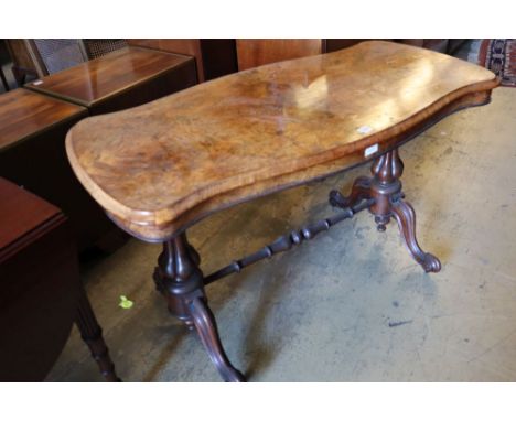 A Victorian figured walnut centre table, with serpentine top, 122 x 61cmCONDITION: A little faded around the edges of the top