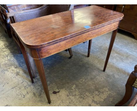 A late George III inlaid mahogany folding card table, width 91cmCONDITION: Relatively recently polished but one large damp ma