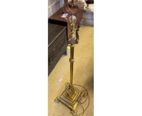 An Edwardian lacquered brass telescopic lamp standardCONDITION: Some light oxidisation otherwise good condition.