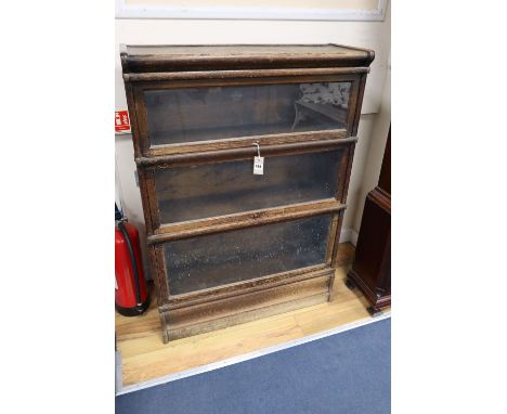 An oak Globe Wernicke three tier bookcase, width 87cmCONDITION: Heavily worn and rubbed from use over the years, will require