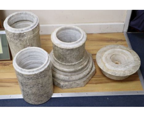 A variegated cream marble pedestal, height 107cmCONDITION: One or two small chips around the edges and light scuff and scratc