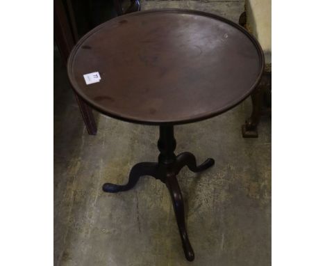 An early 19th century mahogany tripod table, with dished top, width 50cmCONDITION: Rather dirty and dusty, old repairs to the