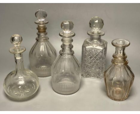 A pair of Regency glass mallet decanters with stoppers, 27cm and three other decanters (5)CONDITION: Some discolouration to p