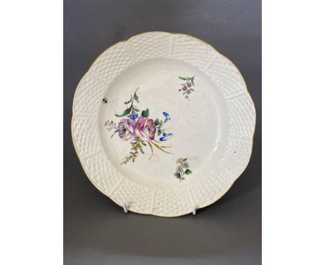 A Chantilly dessert dish, enamel painted with scattered flowers, with wicker border, 23cmCONDITION: Surface scratched