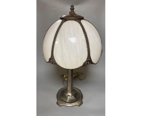 An Art Nouveau style metal table lamp with opaque white glass 'petal' shadeCONDITION: The column has tape mark visible just a