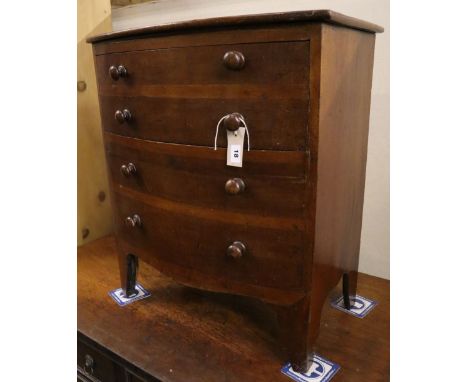 A Regency mahogany bowfront commode (altered), width 60cm depth 39cm height 69cmCONDITION: One knob handle has broken away bu
