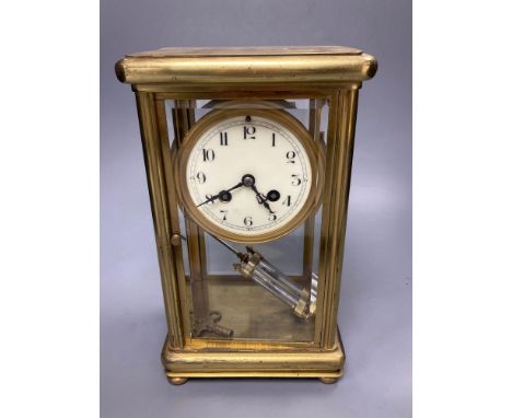 A four glass and brass mantel clock with mercury pendulum, 18cm high, 17cm wide,13cm deepCONDITION: Glass panels uncracked.  