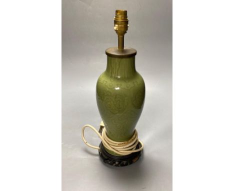 A Chinese green celadon baluster vase, adapted as a table lamp, total height excluding the top fitting 32cmCONDITION: Drill h