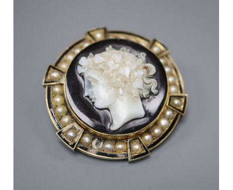 A 19th century gold (tests as 14ct), enamel and pearl target pendant brooch, centred by an onyx cameo carved with the head of