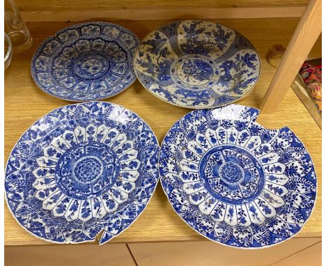 Four Chinese Kangxi period blue and white dishes and a Qianlong blue and white dishCONDITION: Pair recently damaged and tempo