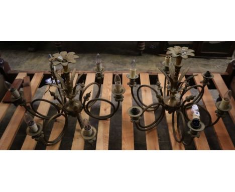 A pair of 20th century gilt metal six light electroliers, with scrolling branches and foliate stems, diameter 65cm drop 46cmC