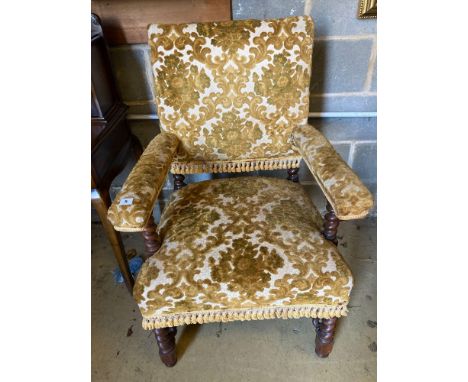 A late Victorian Carolean revival walnut elbow chairCONDITION: Some fading and wear to the upholstery, light wear to underfra