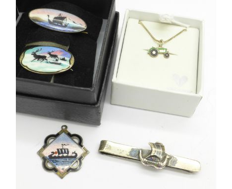 Two silver and enamel brooches, a silver clip marked COF Denmark, a silver and enamel fob, and a small pendant with chain