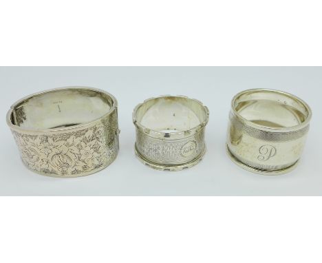 Two silver napkin rings and a silver bangle, a/f, 85g