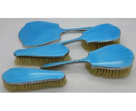 A five piece enamel vanity set