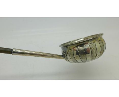 A Georgian toddy ladle with whale bone handle