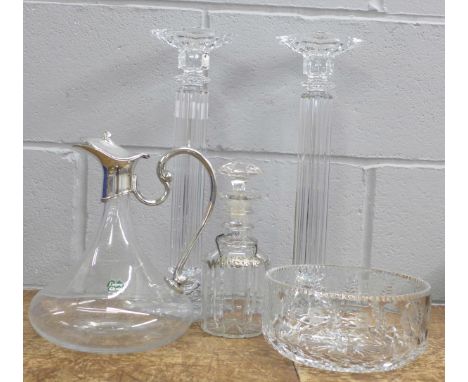 A pair of crystal glass candlesticks, a crystal bowl, decanter and carafe