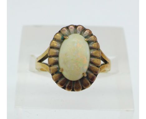 A yellow metal and opal ring, 4.4g, O, opal 11mm x 8mm